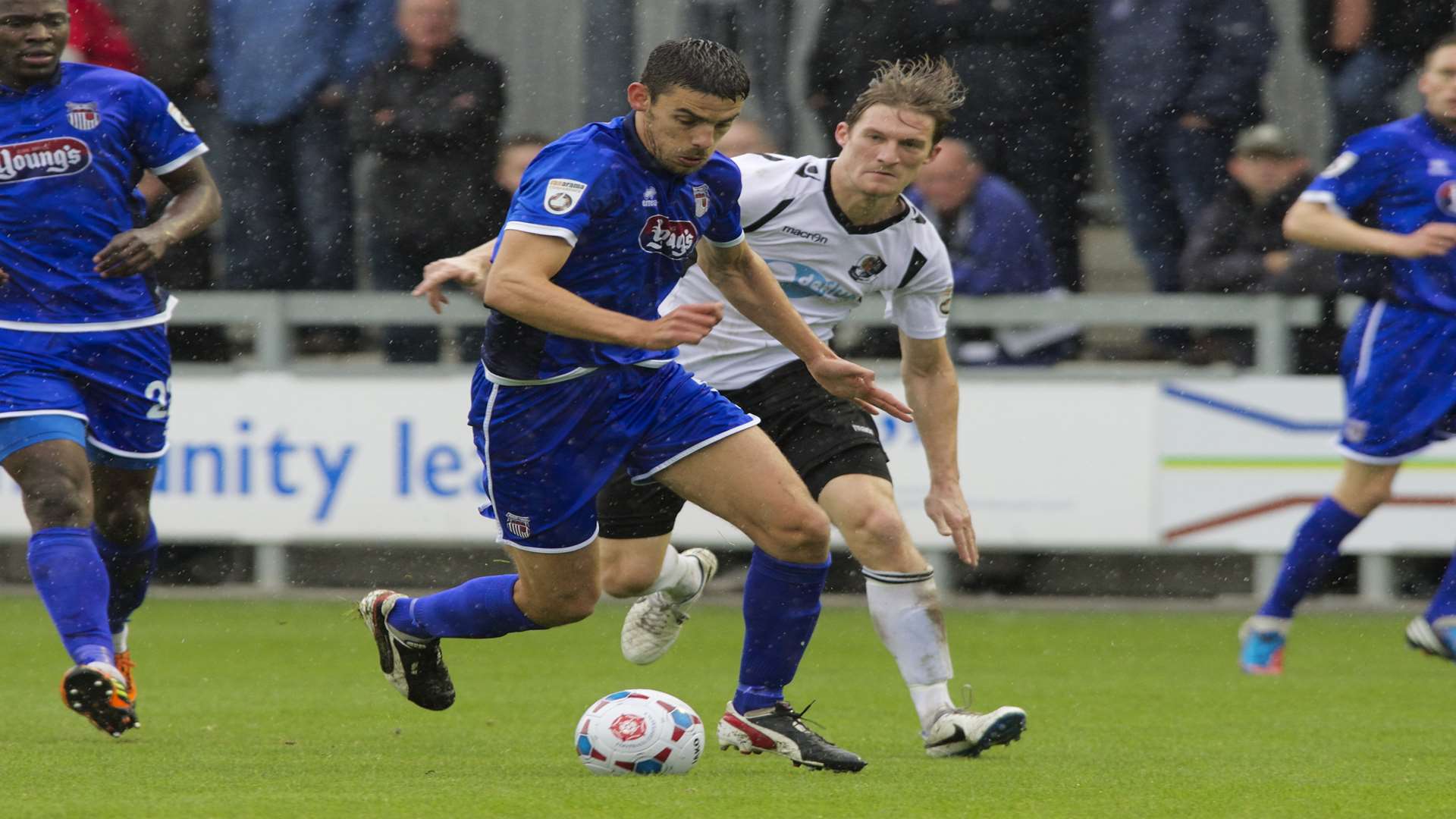 Tom Bradbrook tracks Grimsby Town's Shaun Pearson Picture: Andy Payton