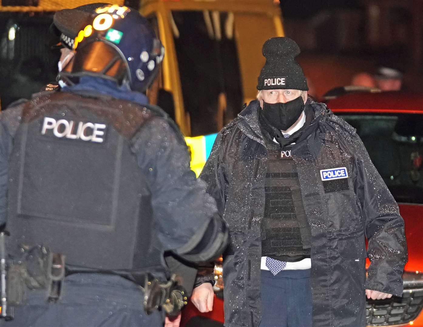 Prime Minister Boris Johnson observes an early-morning Merseyside Police raid on a home in Liverpool as the Government launched ‘crime week’ (Christopher Furlong/PA)