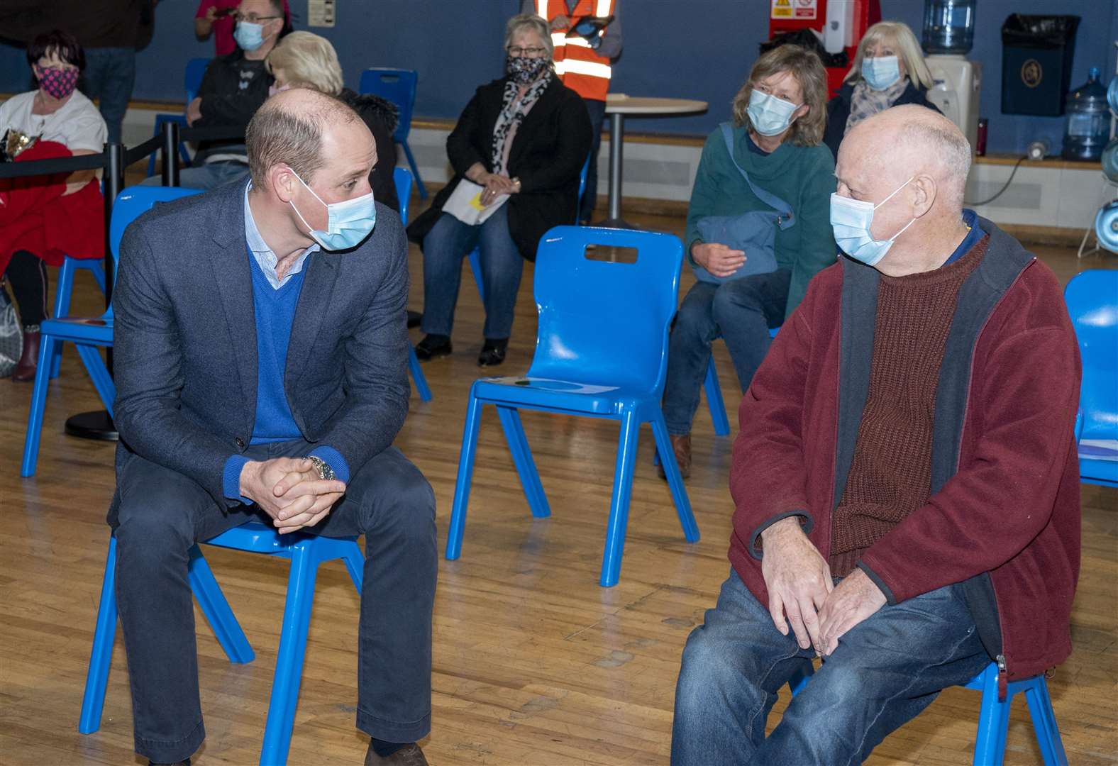 The Duke of Cambridge speaks to Geoff Smyth, 66, as he waits to be vaccinated (Arthur Edwards/The Sun/PA)