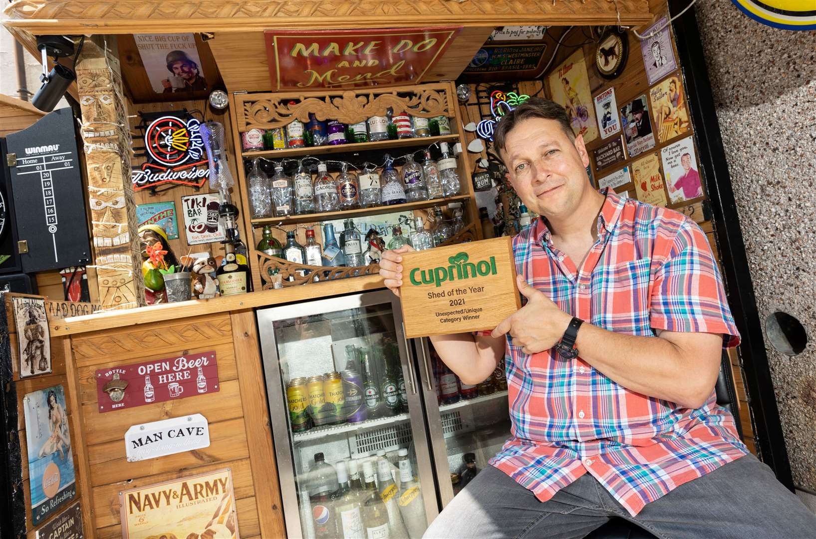 John William with his pop-up shed ‘Bungy’s Backyard Bar’ (Cuprinol Shed of the Year/PA)