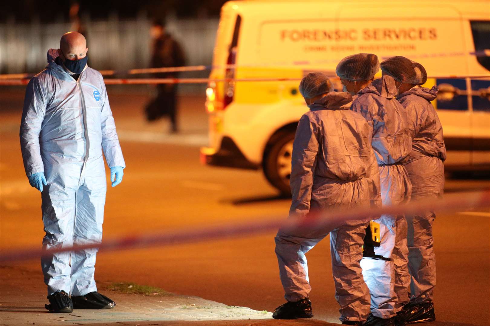 Forensic officers outside Poynders Court on the A205 in Clapham (Yui Mok/PA)