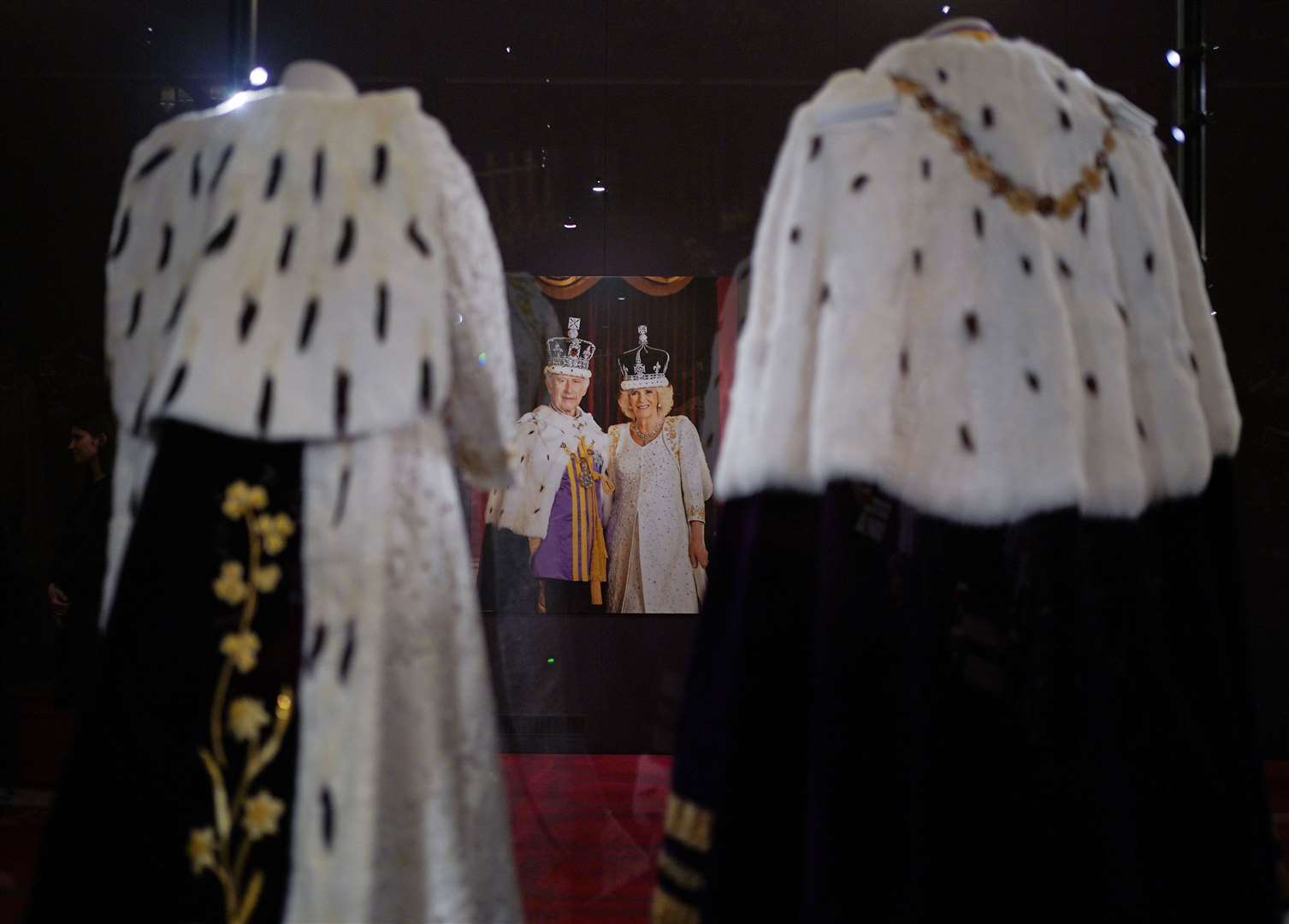 The coronation outfits on show in the Palace ballroom (Yui Mok/PA)