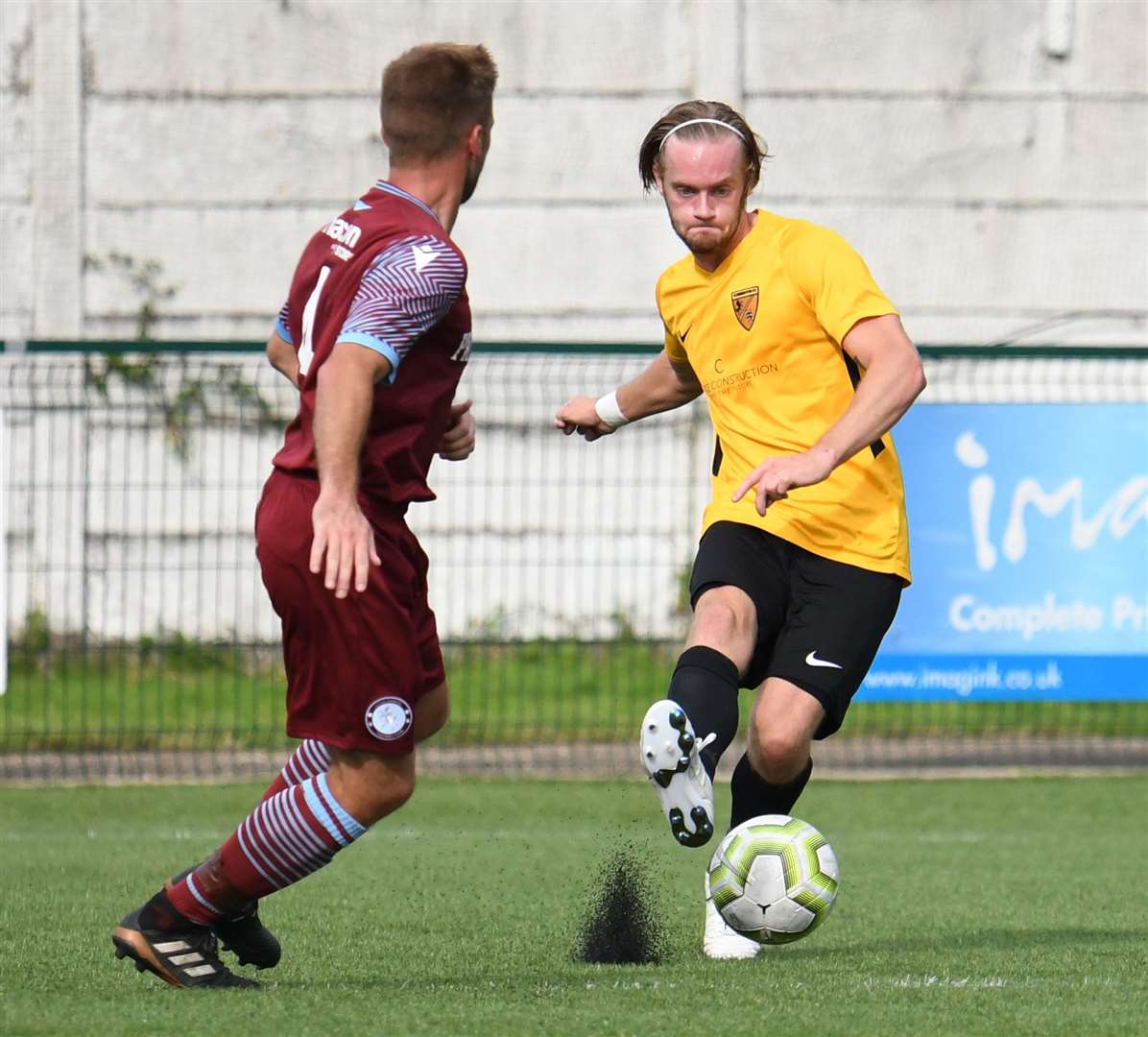 Luke Hughes in possession for Kennington against Little Common in the FA Cup Picture: Paul Davies