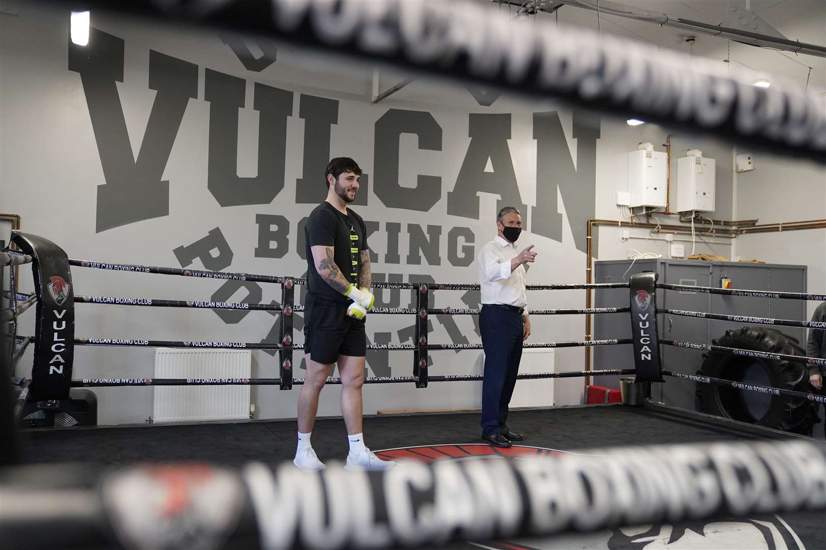 Sir Keir enters the ring with professional cruiserweight Sonny Taylor (Owen Humphreys/PA)