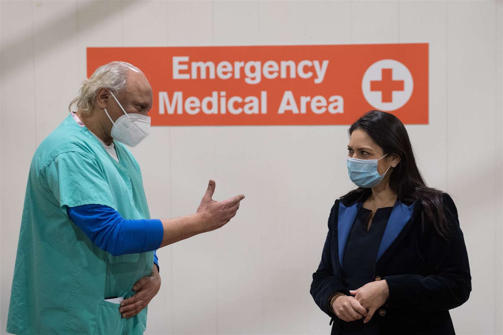 Home Secretary Priti Patel meets NHS staff and volunteers, including deputy head clinician Dr Dilip Patel, at the Byron Hall Vaccination Centre in Harrow, north London (Stefan Rousseau/PA)