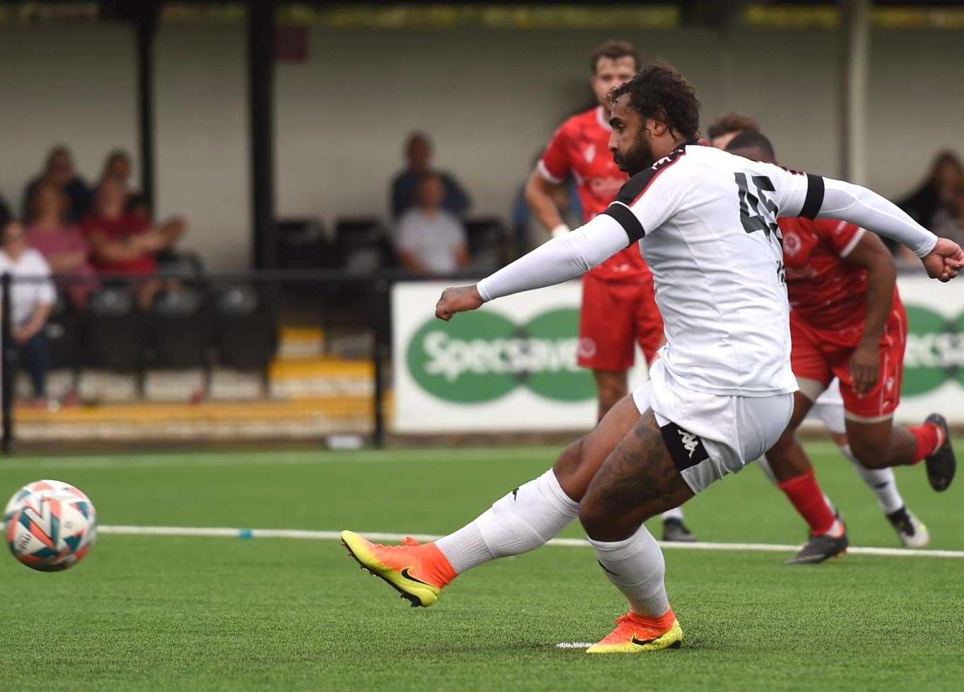 Faversham’s Stefan Payne completes his hat-trick from the penalty spot. Picture: Ian Scammell