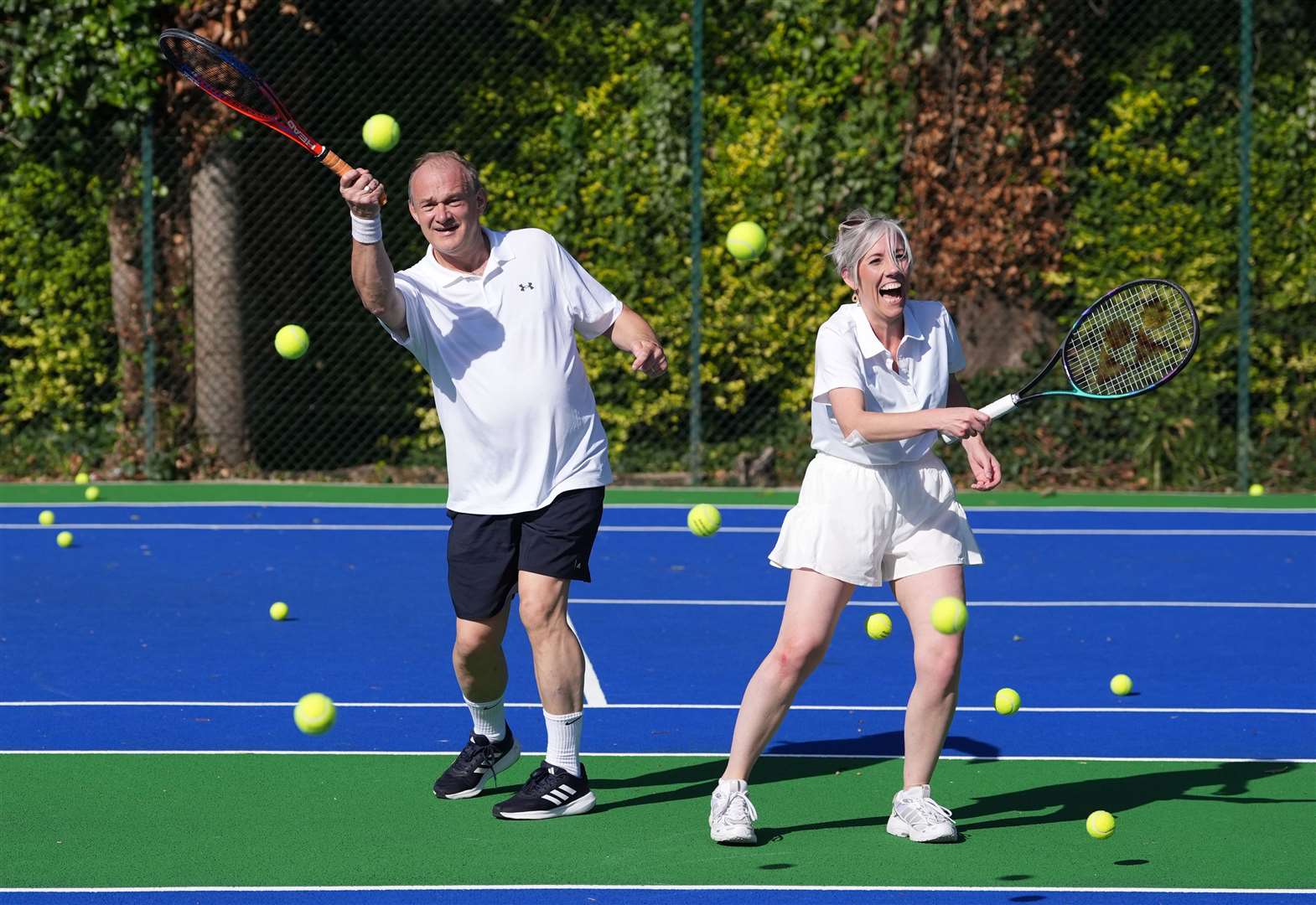 Sir Ed Davey played tennis with deputy leader Daisy Cooper earlier in the day (Gareth Fuller/PA)