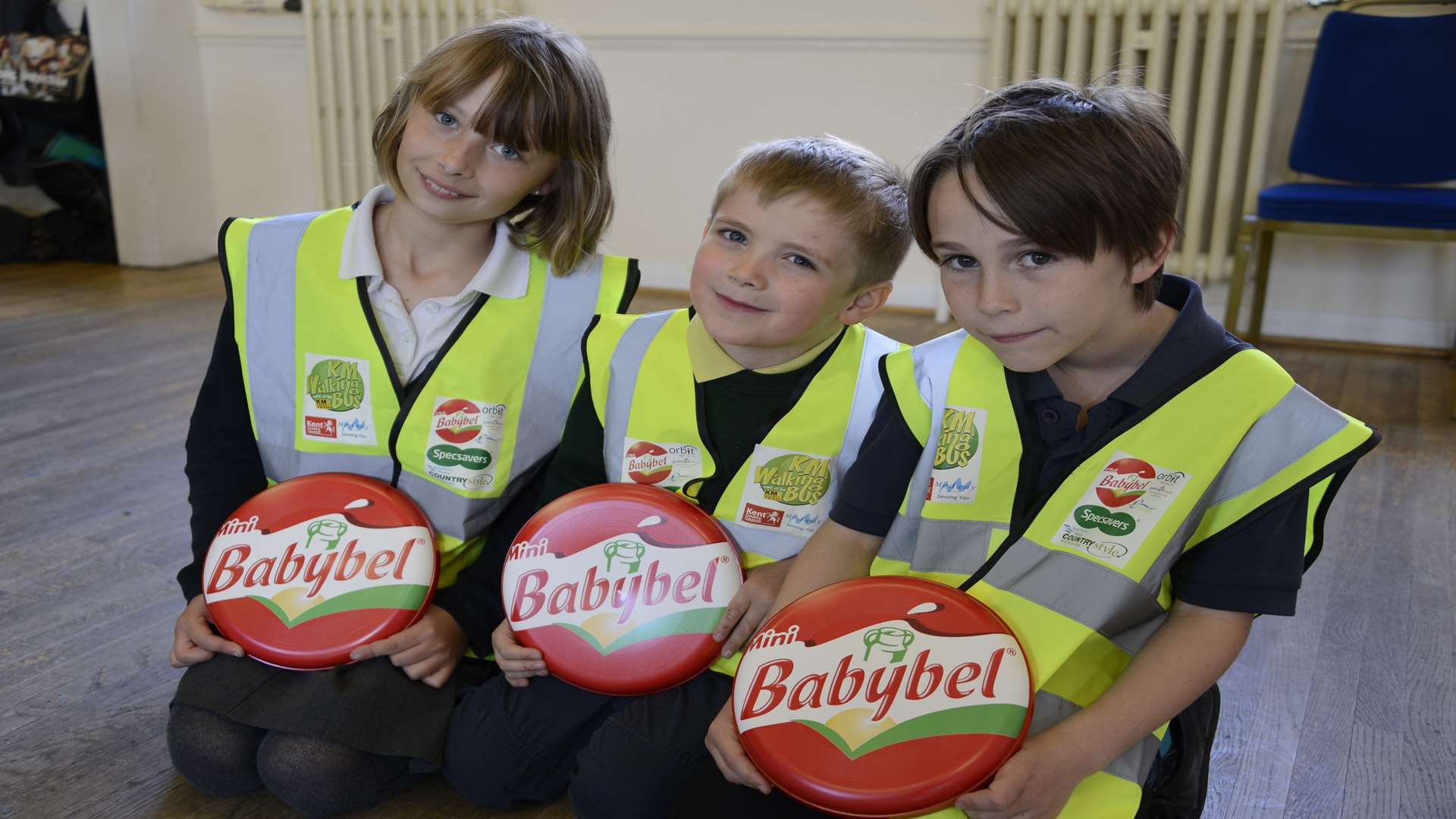 Abi Baxter, Mason Willis and Toby Murphy wear their hi-vis tabards ready to take the new walking bus to the StArs after school homework club.