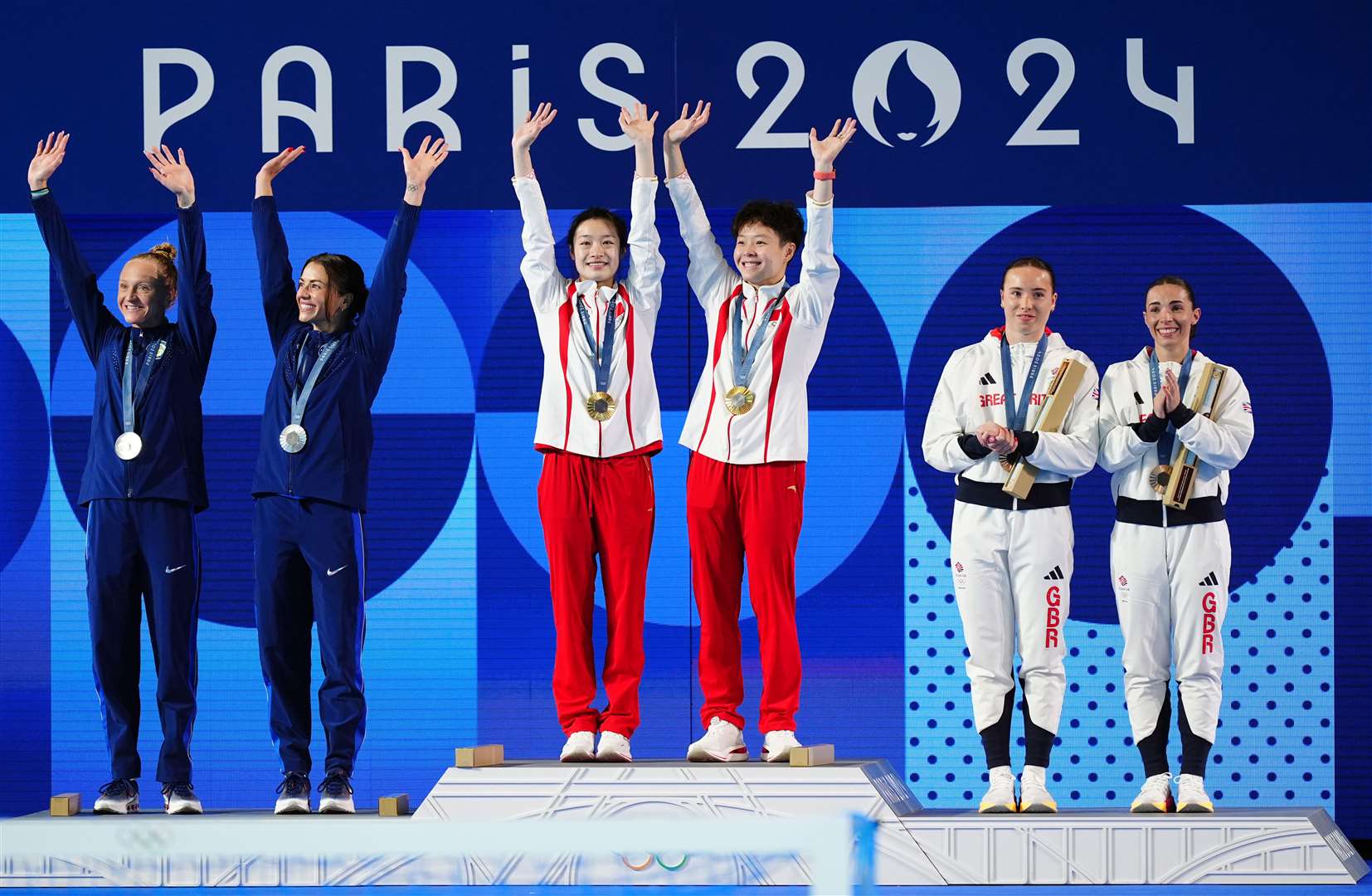 The medallists at the Aquatics Centre in Paris (Mike Egerton/PA)