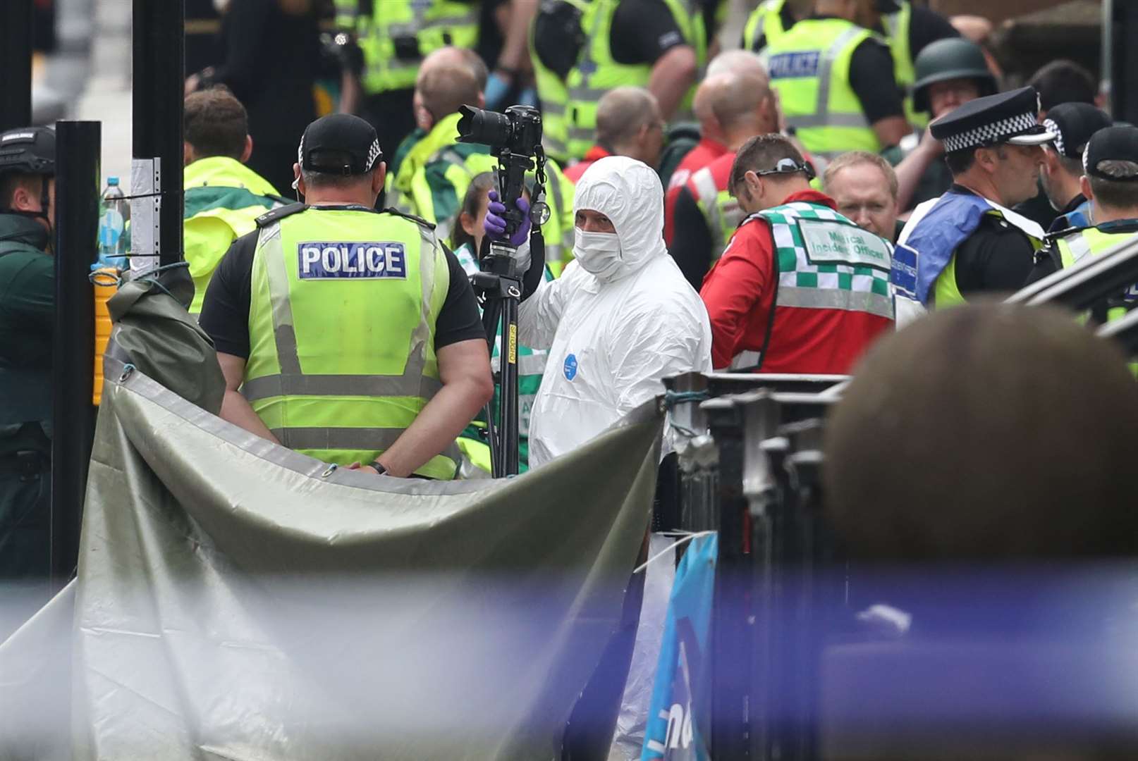 Police and forensic officers at the scene (Andrew Milligan/PA)