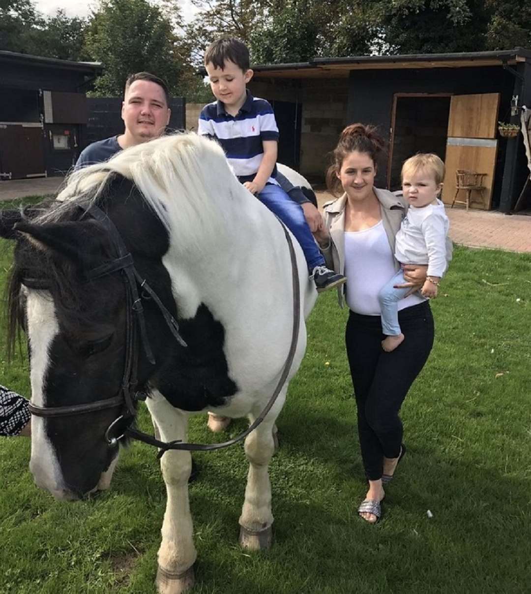 Arlo Bennett, right, with his family (Irwin Mitchell Solicitors/Family/PA)