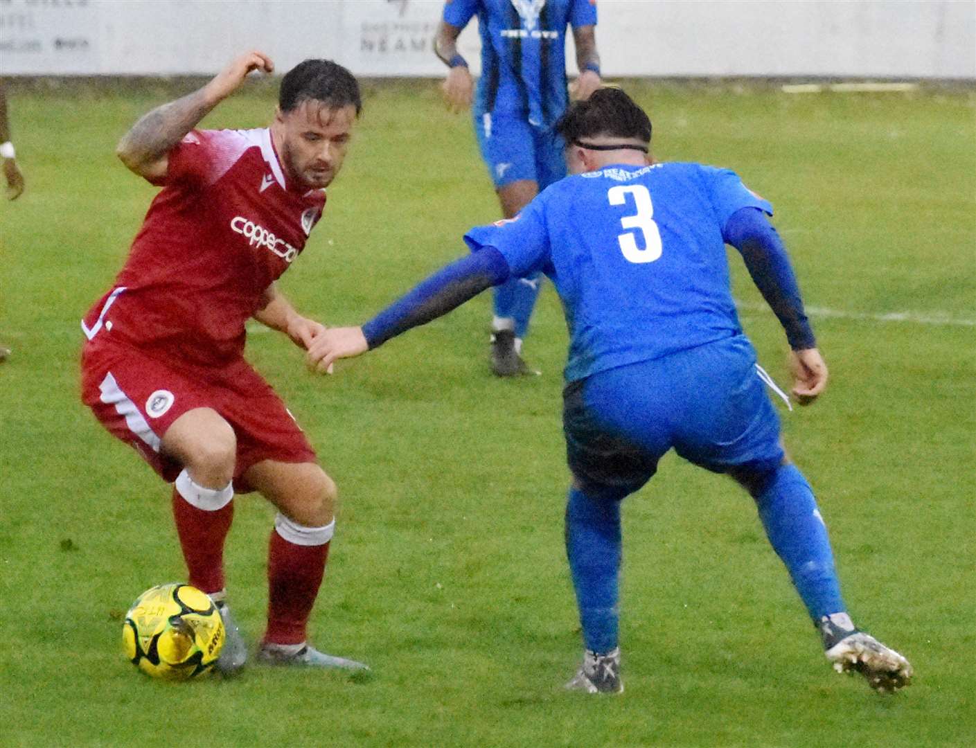 Hythe striker Danny Parish tries to get past Steyning Town’s Billy Fuller on Saturday.Picture: Randolph File