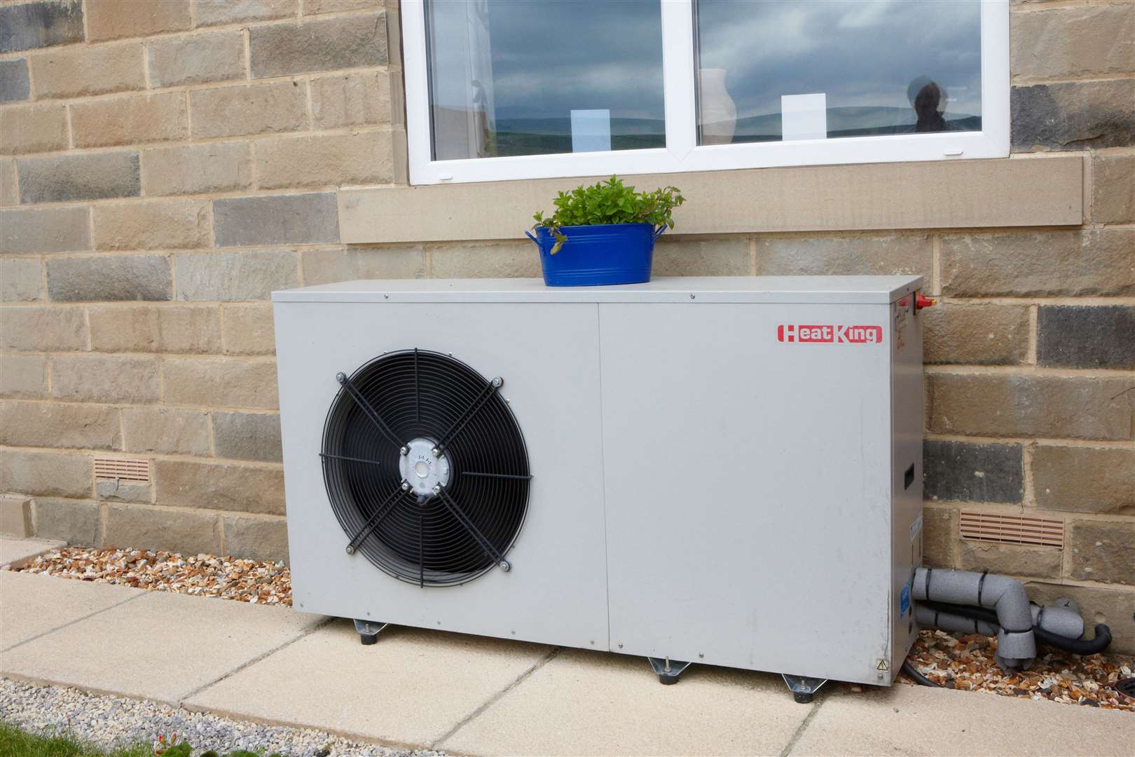 An air source heat pump outside a house (Alamy/PA)