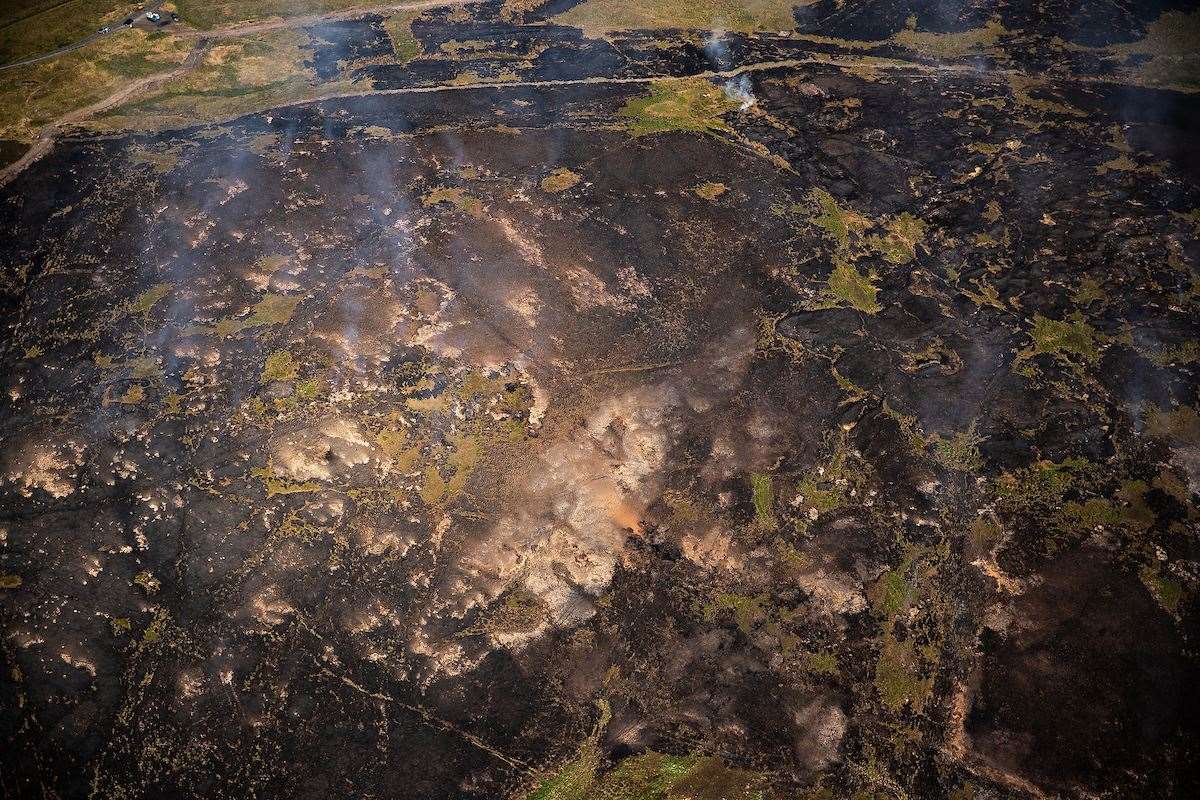 Land damaged by fires burning at Smithills (Joel Goodman/Woodland Trust/PA)