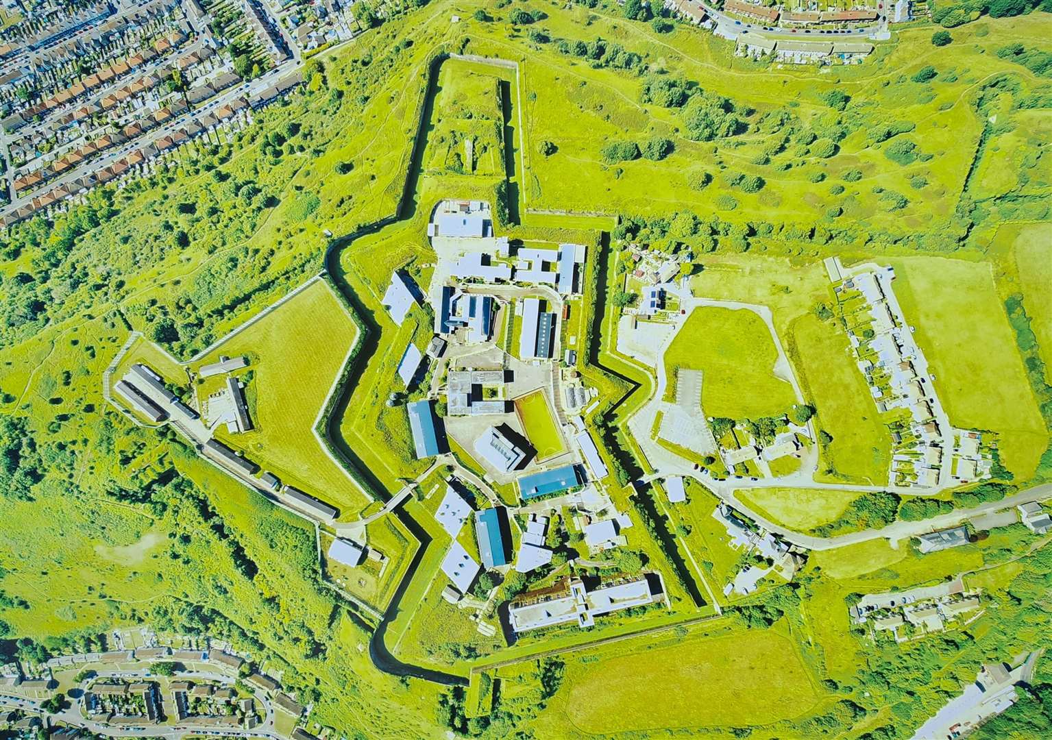 Aerial photograph of the Citadel complex. The distinctive Officers' Quarters are at the bottom. The streets on the top left are in Maxton and on the top right, Westbury. Picture: Dover Citadel Ltd