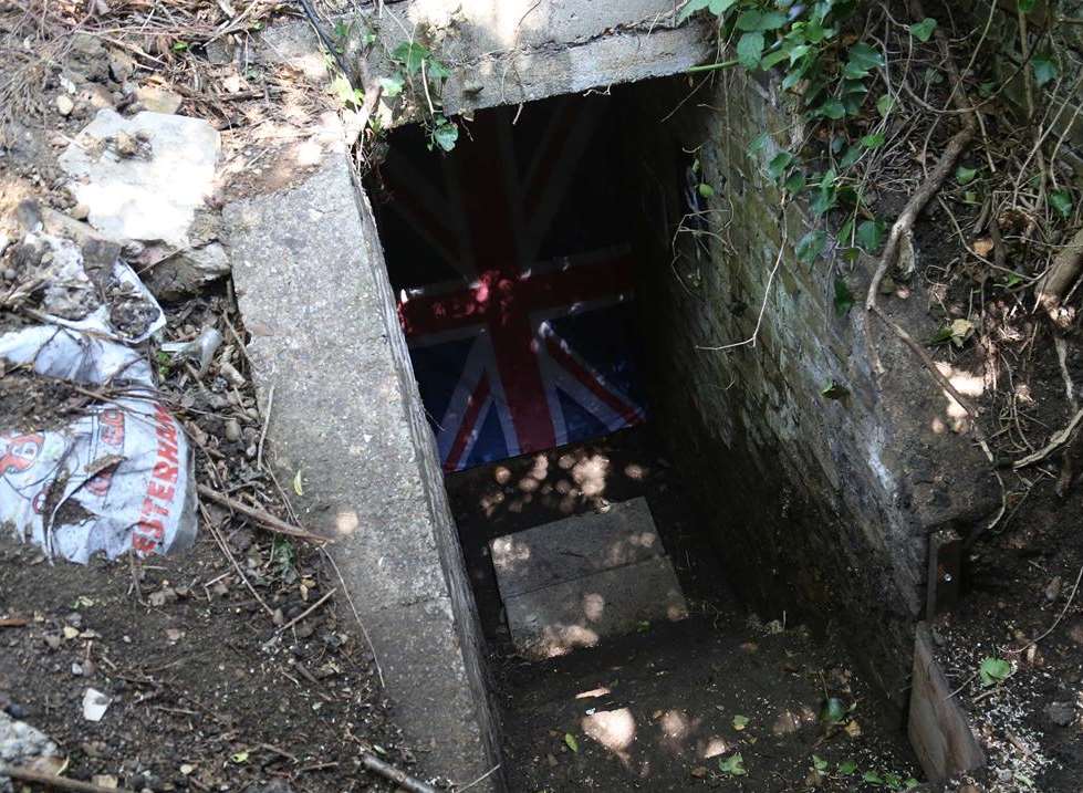 The school caretaker and a parent helper have discovered an Anderson air raid shelter in the school grounds