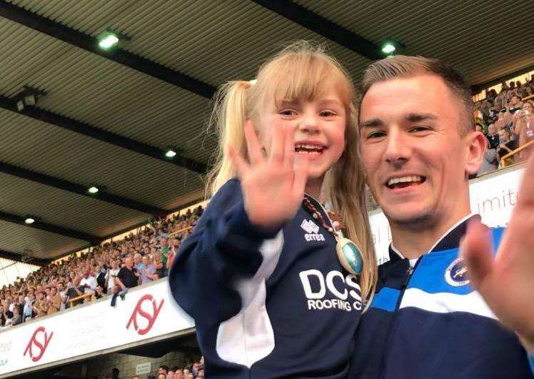 Player Byron Webster carried Ellice out onto the pitch before the game