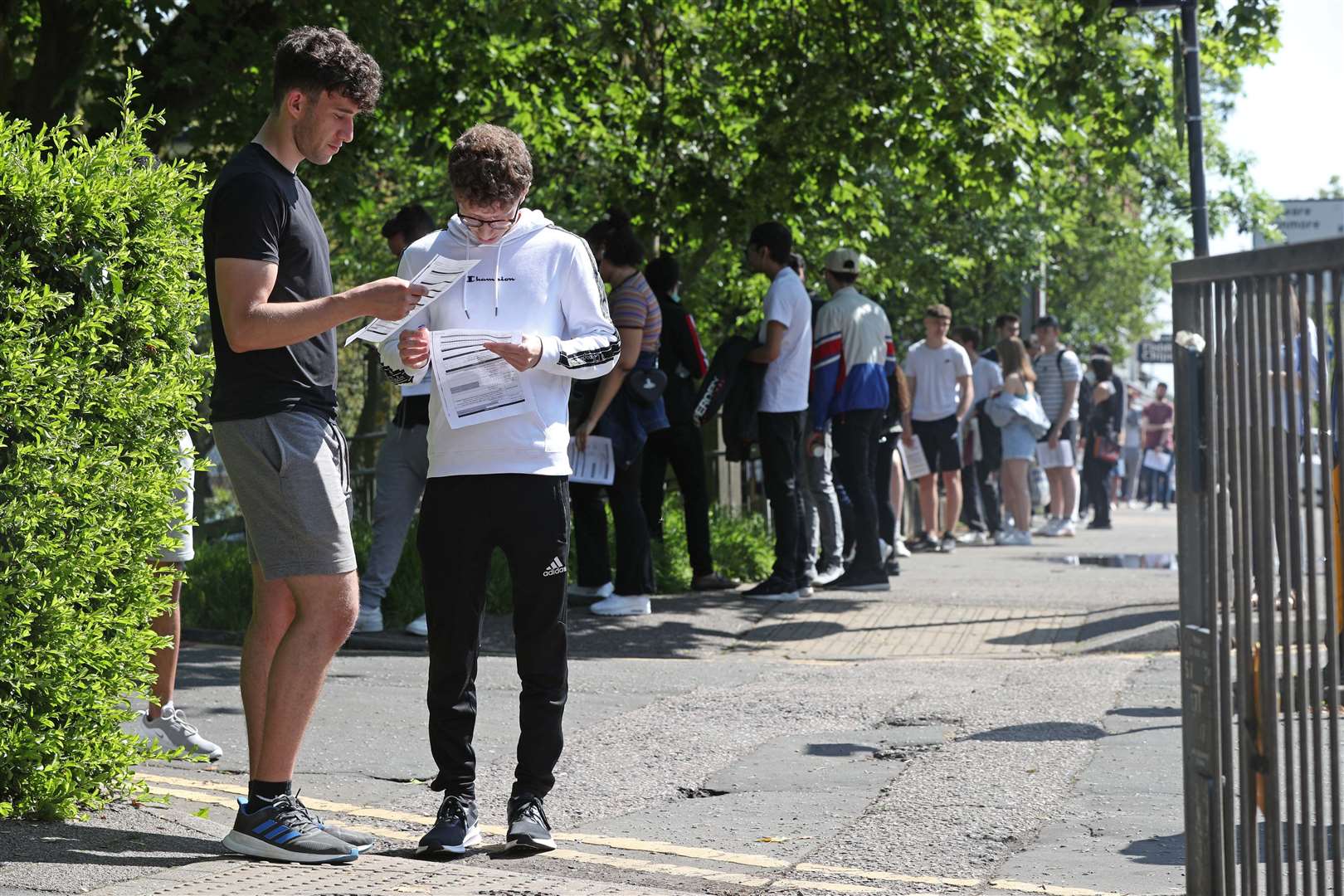 20-year-old students Jamie Lesser and Daniel Simmons outside Belmont Health Centre in Harrow (Jonathan Brady/PA)