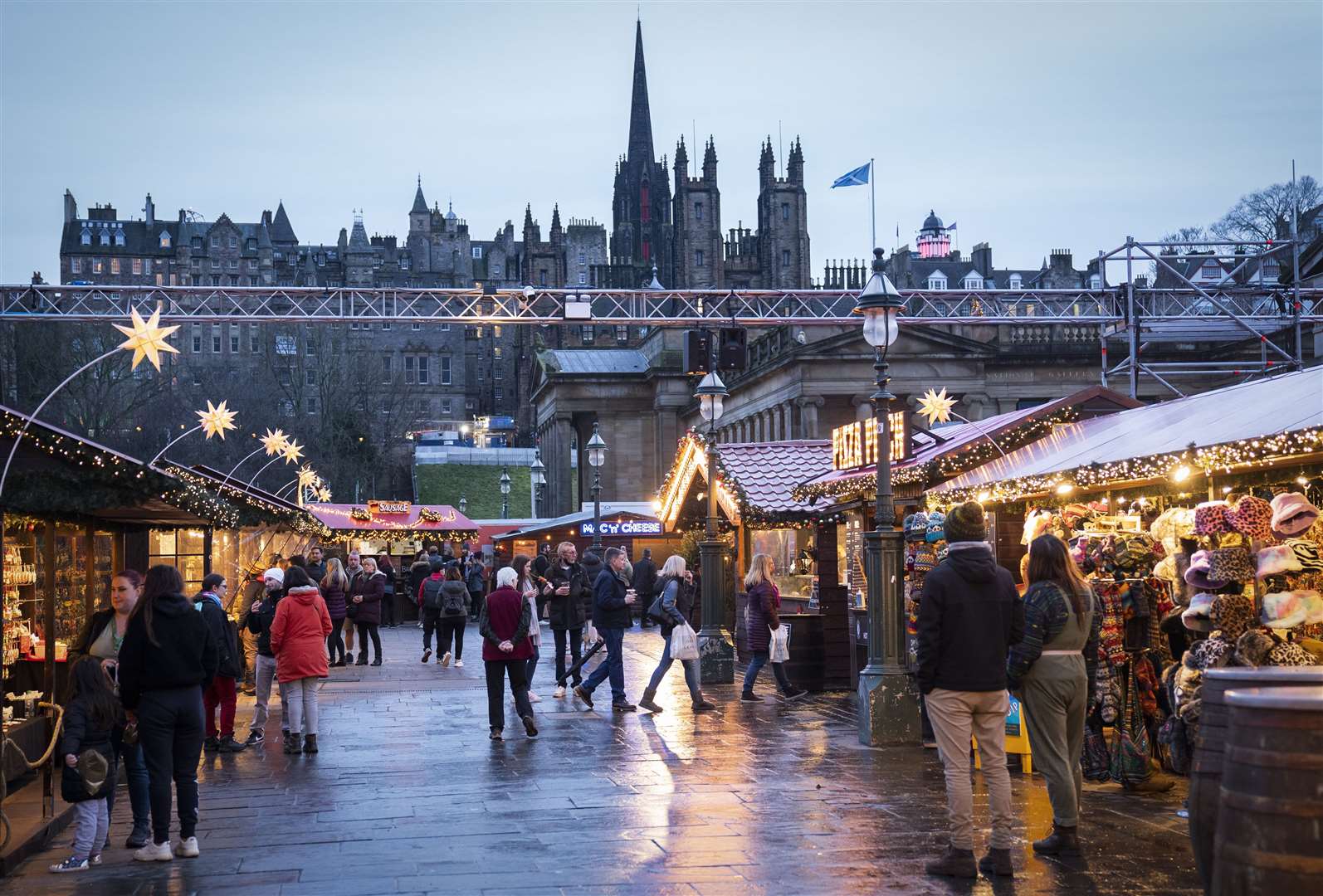 Shoppers at the Christmas Market on Edinburgh’s Princes Street on New Year’s Eve (Jane Barlow/PA)