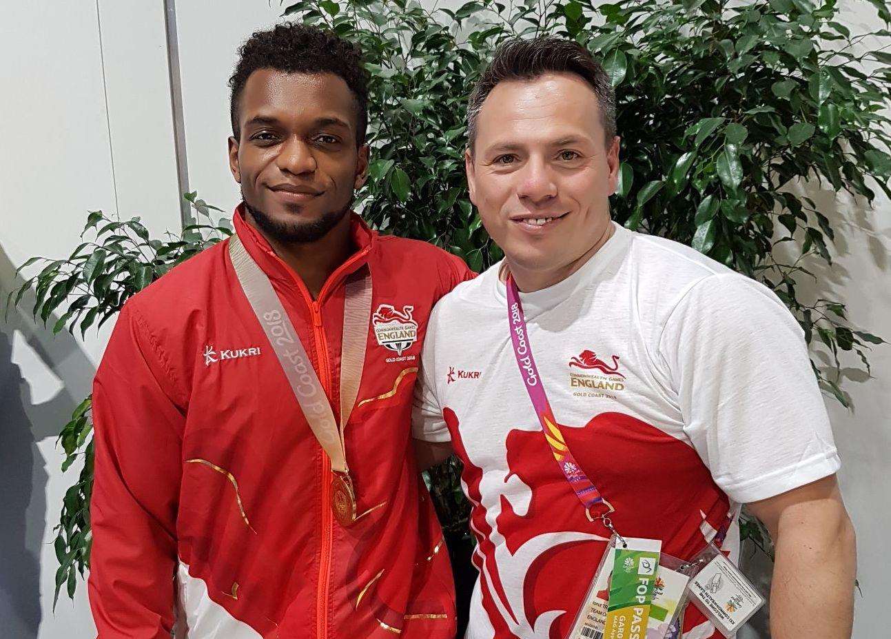 Pegasus gymnast Courtney Tulloch with coach Ionut Trandaburu after rings gold