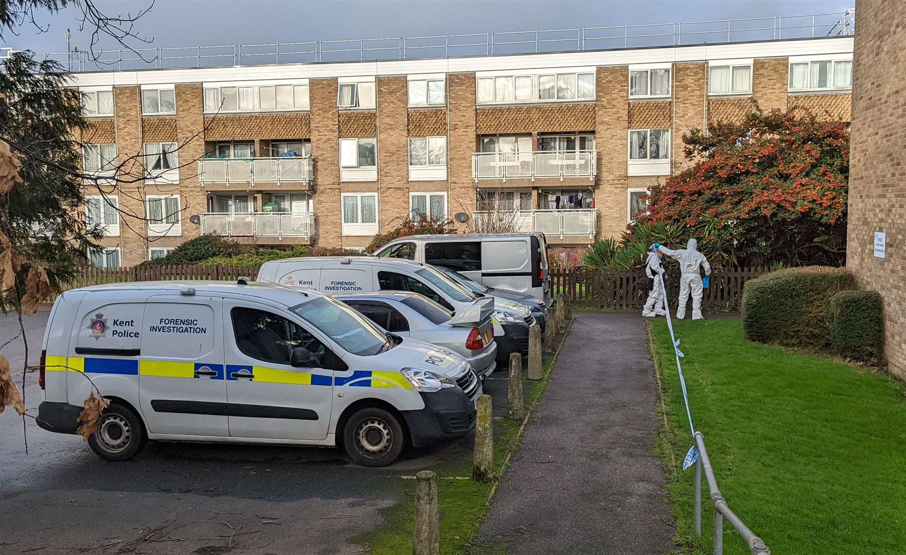 Police vehicles in the car park at Spencer House