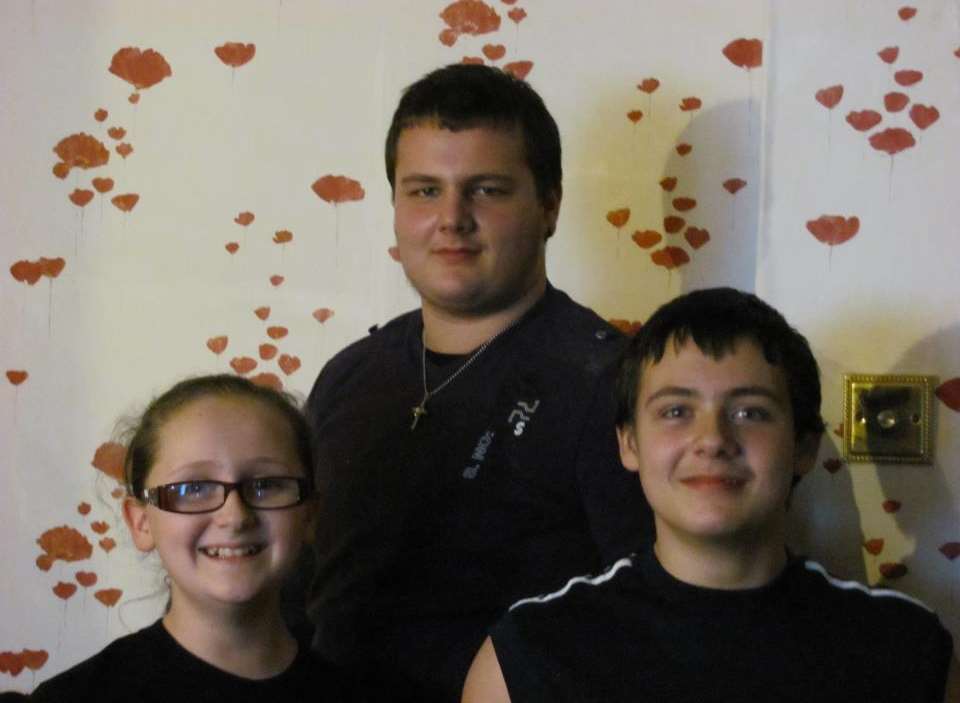 David Brookes, centre, with his brother Thomas and sister Rachael