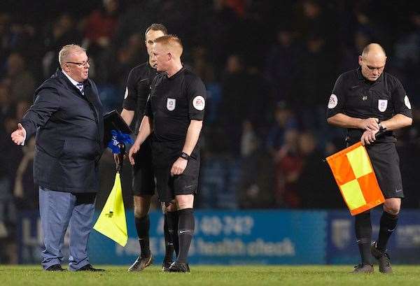 Steve Evans talks with referee Alan Young, feeling his team should have been awarded a couple of penalties Picture: Ady Kerry (25686098)