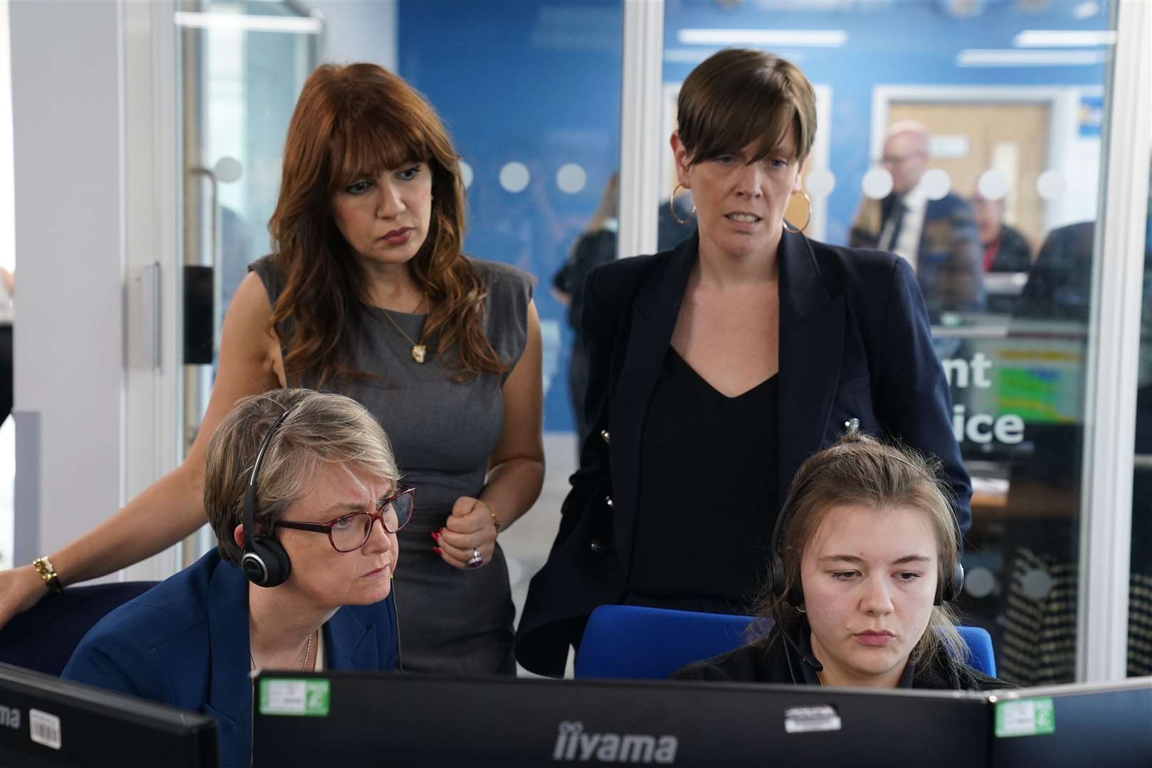 Home Secretary Yvette Cooper (front left) and safeguarding minister Jess Phillips (back right) with counsellor and campaigner Nour Norris (back left) during a visit to meet 999 control handlers at Kent Police (Gareth Fuller/PA)