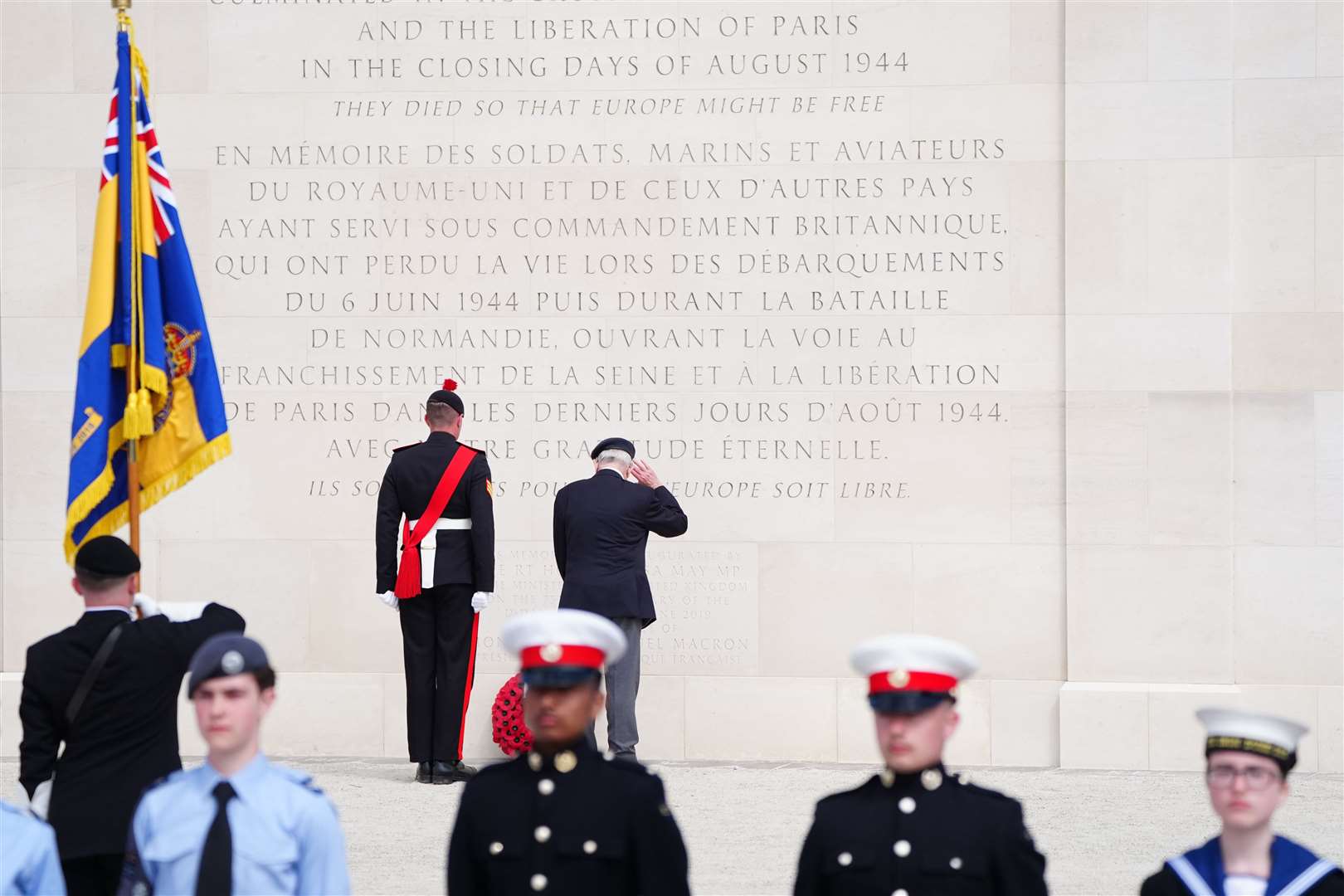 A veteran lays a wreath during the commemorative event in Ver-sur-Mer (Jane Barlow/PA)