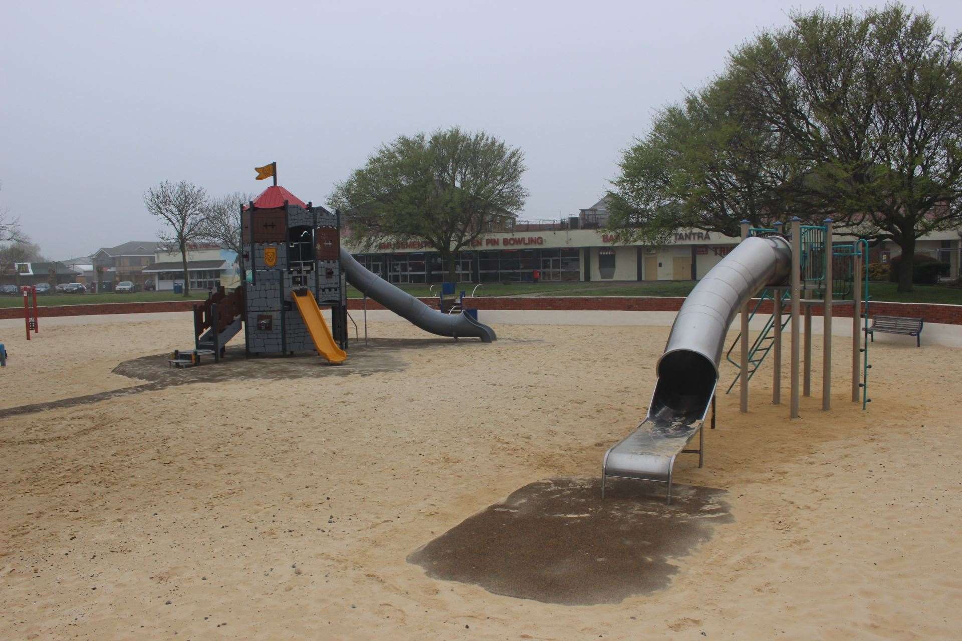 Castle slide and metal slide at the sandpit children's play area at Beachfields on the seafront at Sheerness