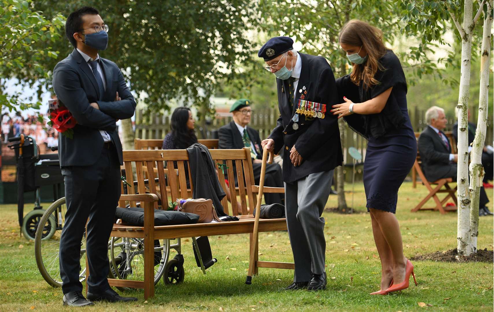 Each veteran was given a bench to sit on to ensure social distancing (Oli Scarff/PA)