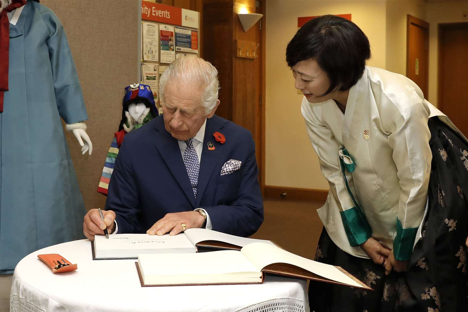 Charles signed the guest book as he arrived at the New Malden Methodist Church (John Phillips/PA)