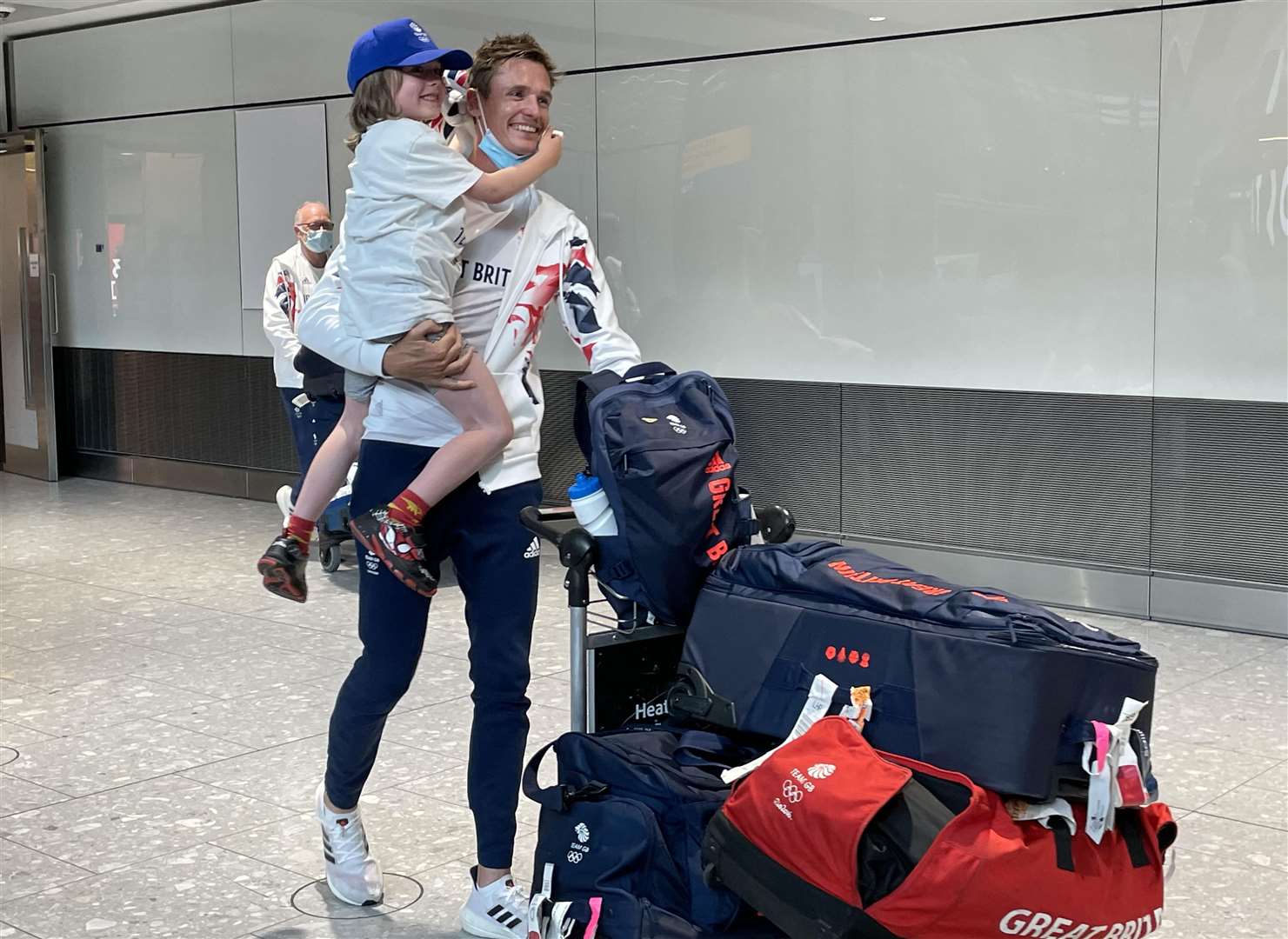 Gold medal winning sailor Dylan Fletcher arrives at Heathrow (Elmira Tanatarova/PA)