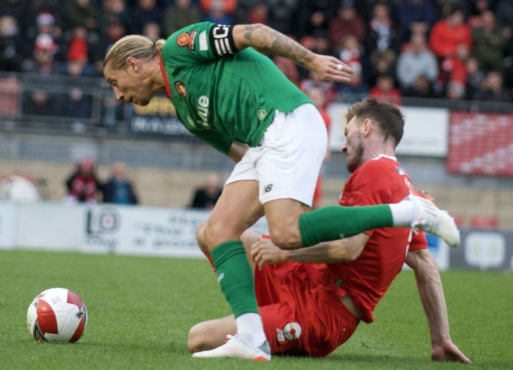 Fleet captain Lee Martin skips away from a Leyton Orient challenge. Picture: Ed Miller/EUFC