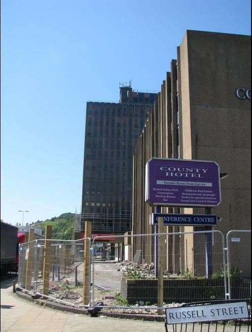 Hoardings go up around County Hotel