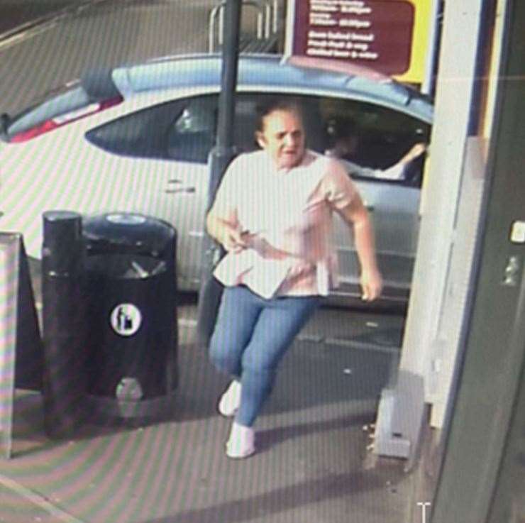 Habitual offender Kathleen Perry using the cashpoint to withdraw the cash from the Sainsbury's Local, in Tonbridge Road, Maidstone