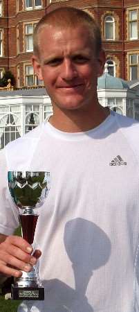 Sam Rigby with his trophy after victory at the Rotary Folkestone Half-Marathon