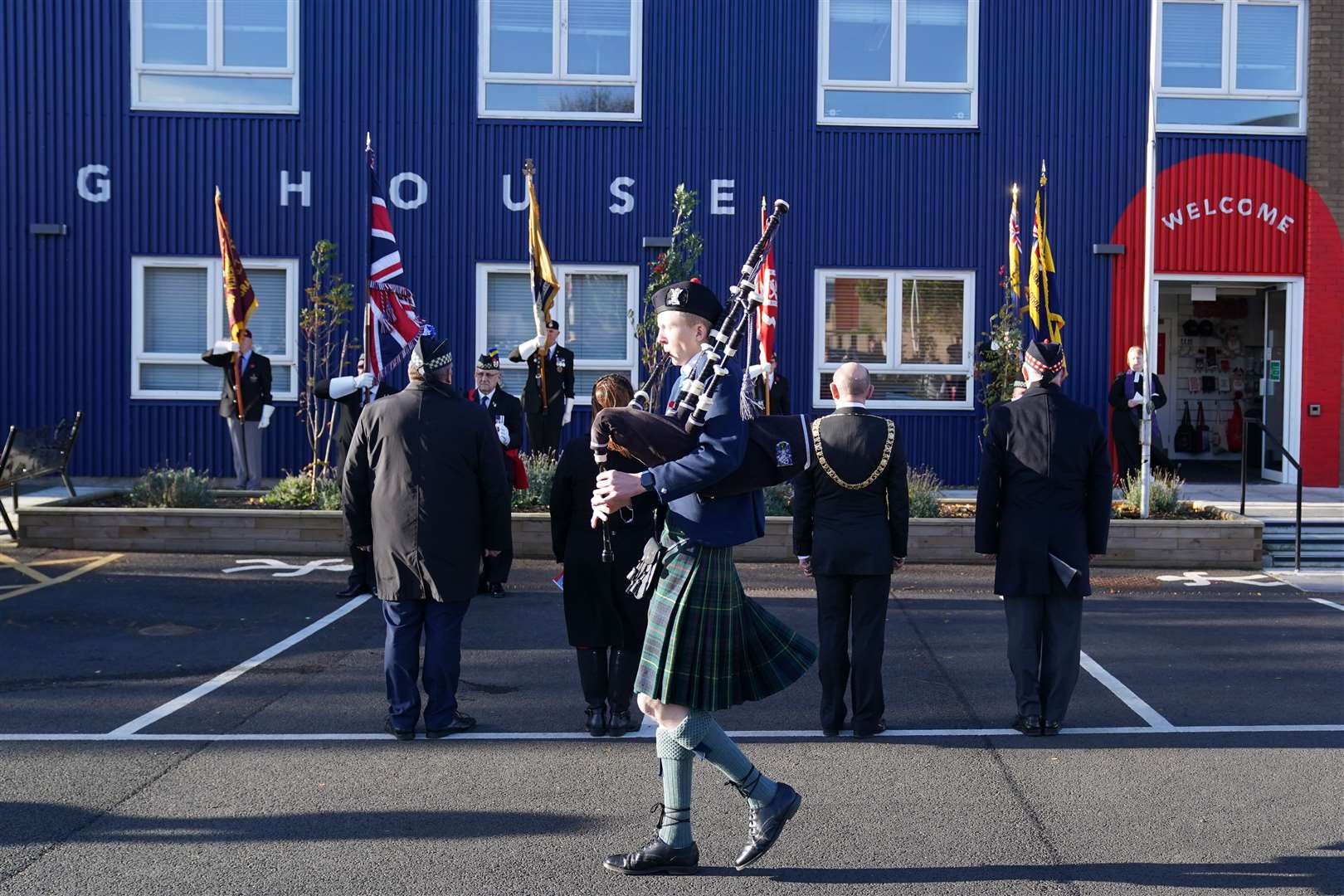 A piper plays during an Armistice Day service at Poppyscotland’s Lady Haig Poppy Factory in Edinburgh (Jane Barlow/PA)