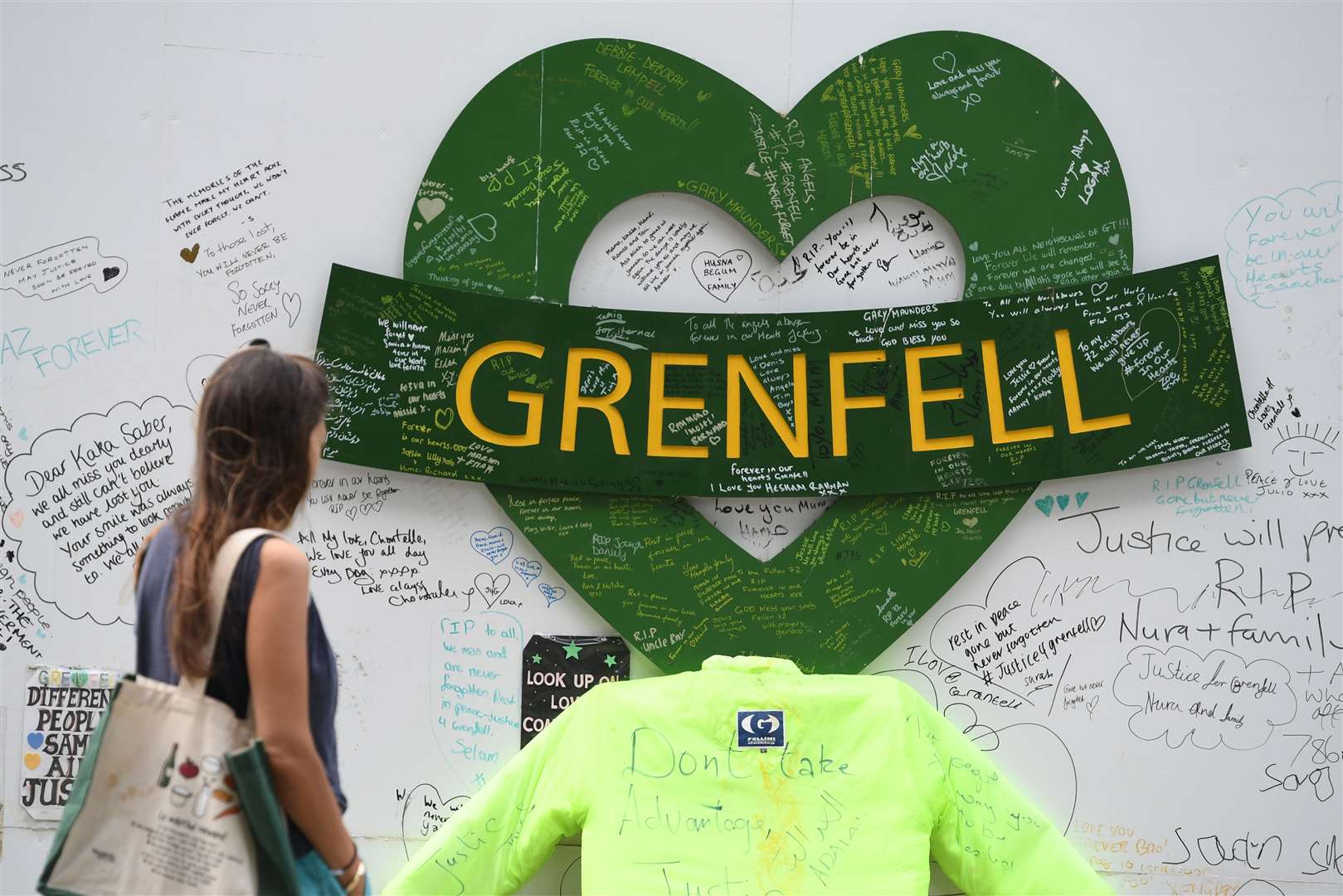 The Grenfell Memorial Community Mosaic at the base of the tower block in London (Kirsty O’Connor/PA)