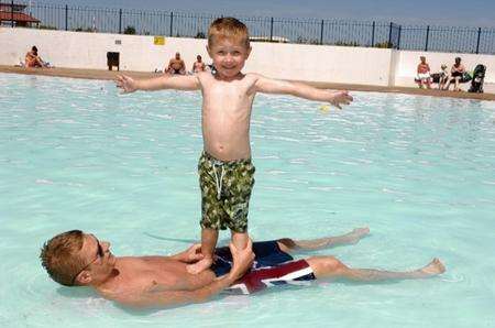 Sun at the Strand - Solomon Sutcliffe, 4, with Uncle Chay Bailey