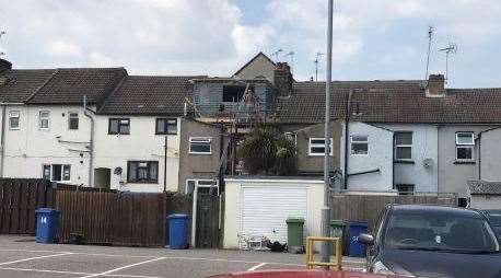 The houses behind the development are only two-storey