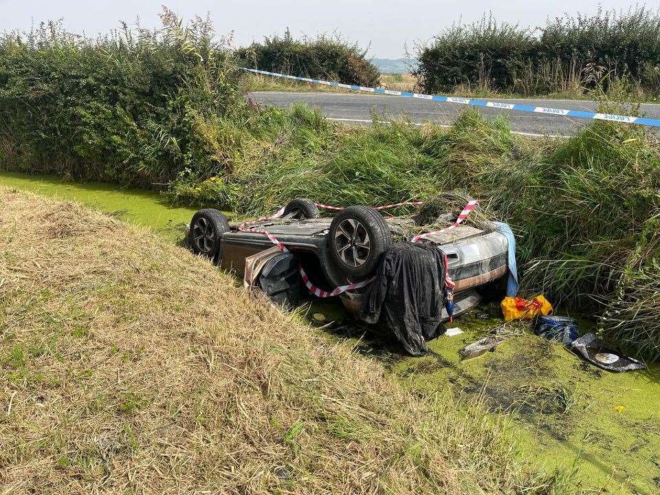 The car in the ditch which runs alongside Eastbridge Road, near Burmarsh