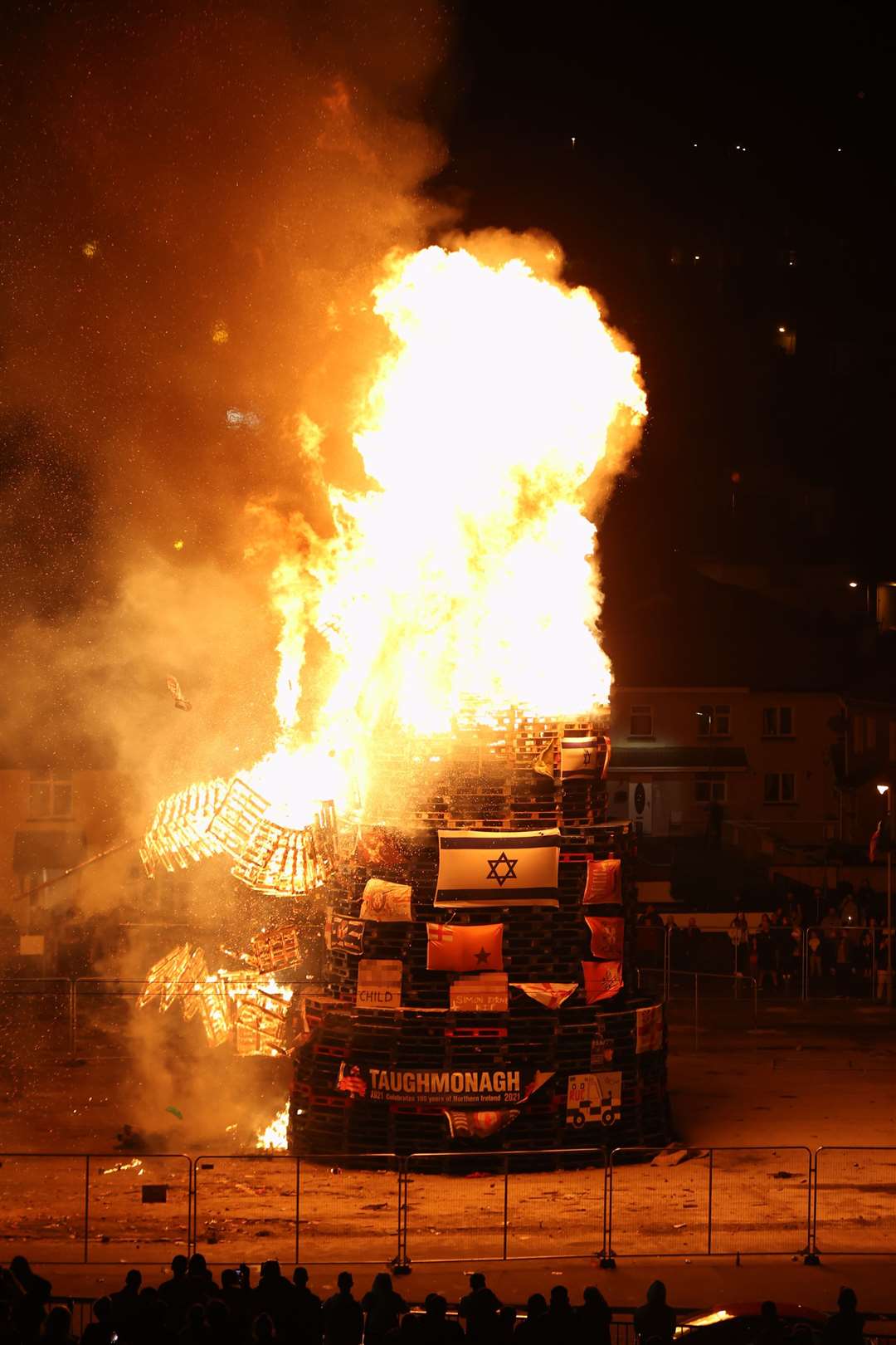 The bonfire in the Bogside area of Londonderry is lit on Sunday night (Liam McBurney/PA)