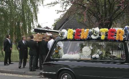 The coffin is carried from the church at Twydall. Picture: PETER STILL