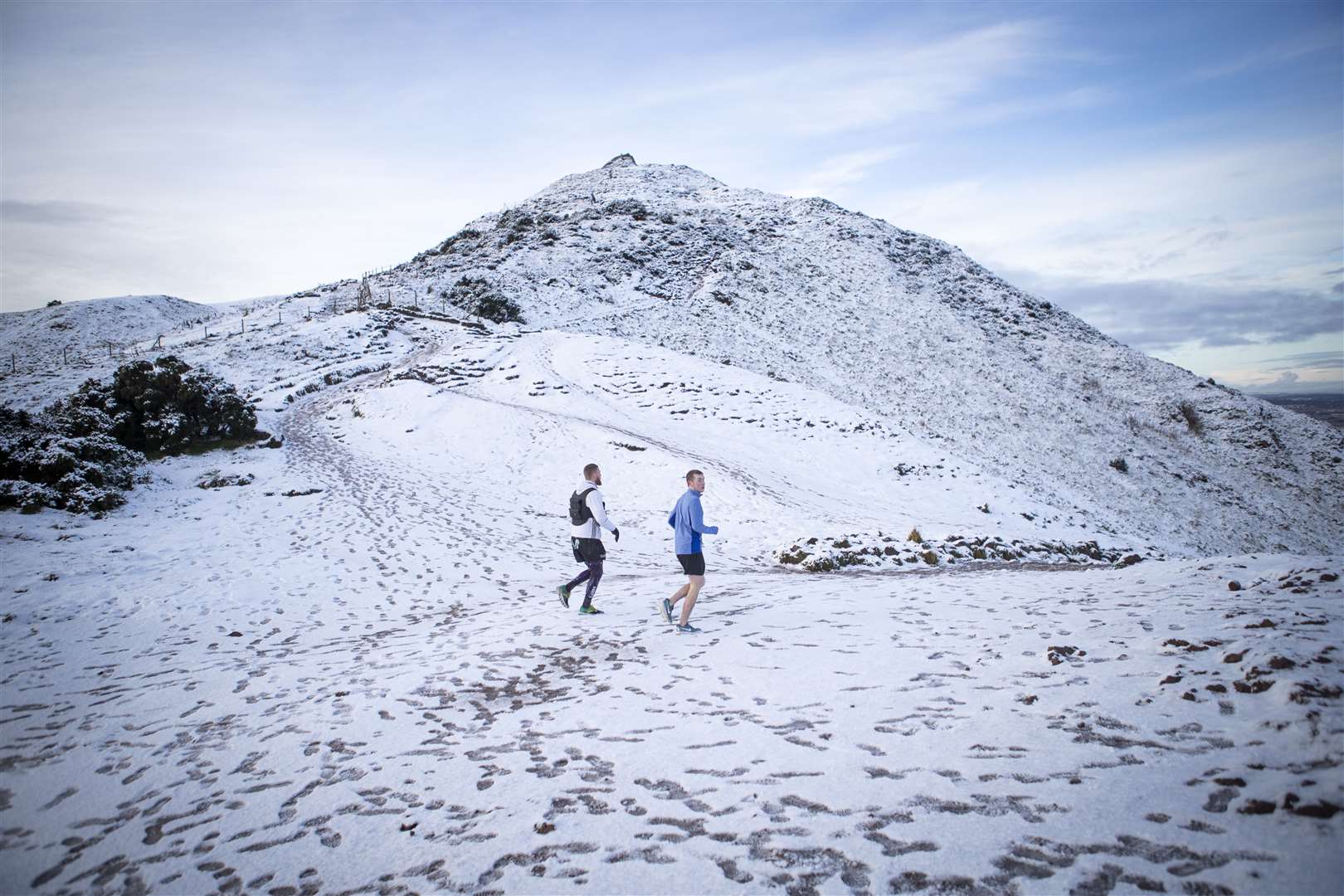 Two fell runners braved the slippery trails near the summit of Arthur’s Seat, Edinburgh (Jane Barlow/PA)