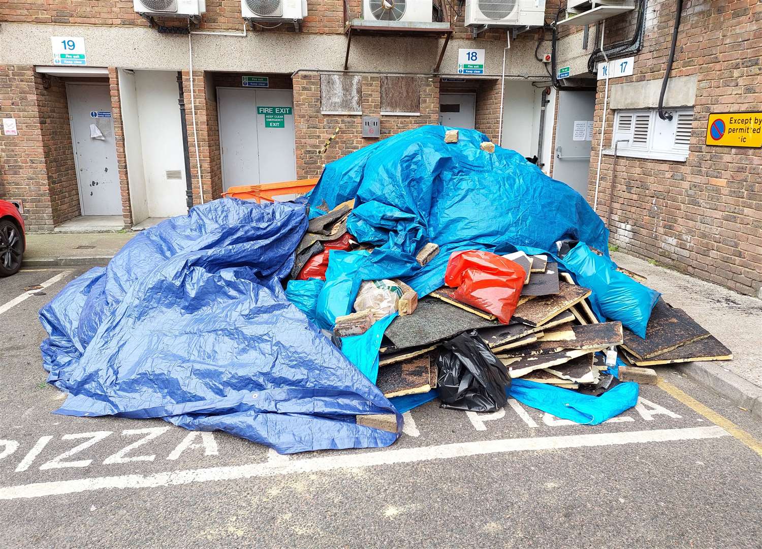 Debris in a rear service yard off Tufton Street