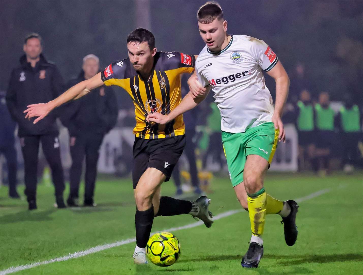 Folkestone forward Dan Smith - who was later red-carded - battles for the ball with Dover defender Luca Cocoracchio. Picture: Helen Cooper