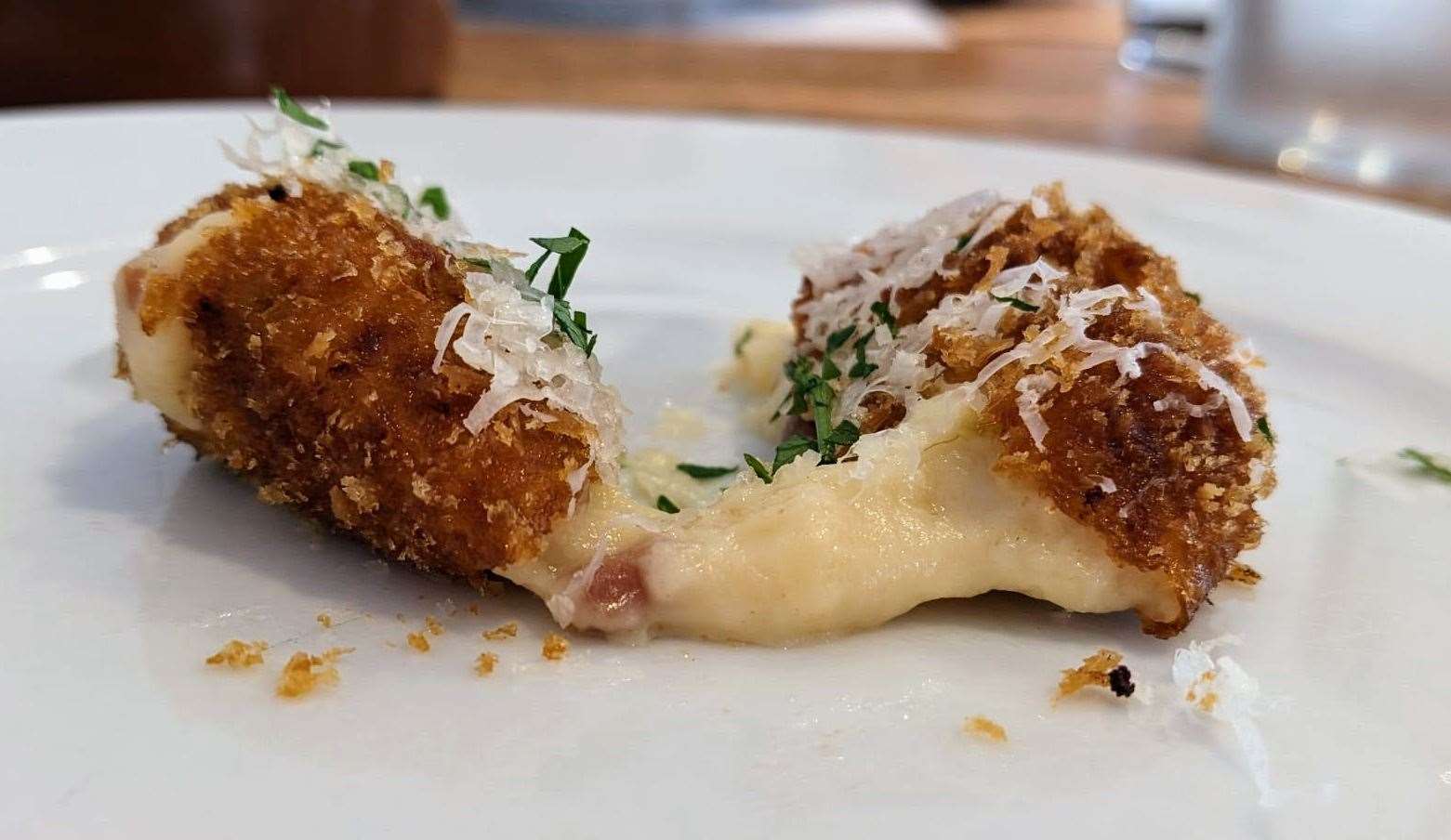 Sauce oozes from the jamon croquettas