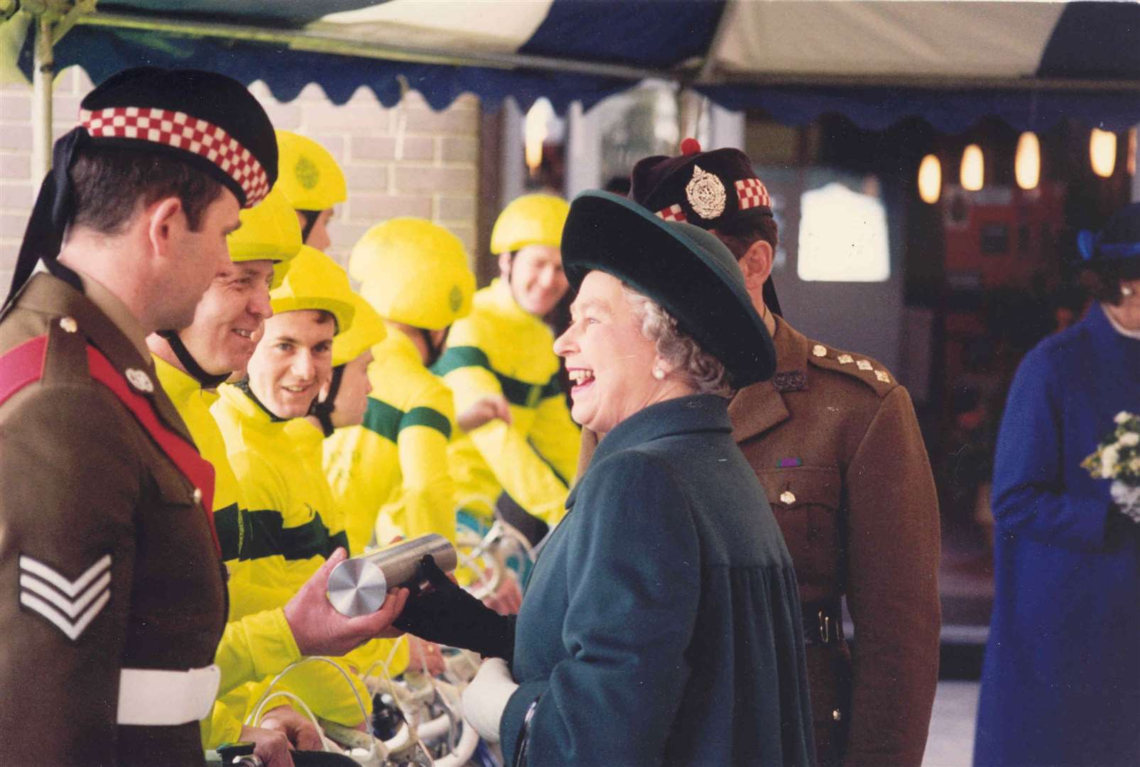The Queen came to Folkestone in February 1994 to celebrate the 200th anniversary of the Argyll and Sutherland Highlanders Regiment of which she is Colonel-in-Chief. She visited the 650 soldiers at Shorncliffe Barrracks and started a sponsored cycle ride by eight soldiers to Stirling. She is pictured enjoying a laugh with one of the cyclists