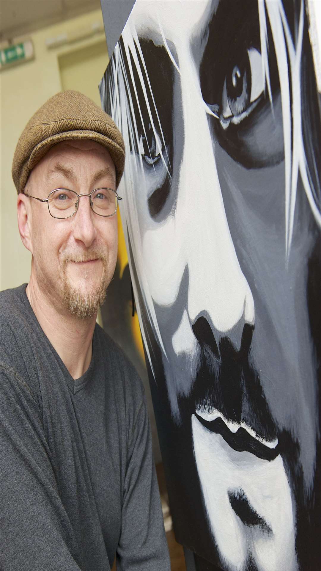 Dean Tweedy, with a portrait of Kurt Cobain